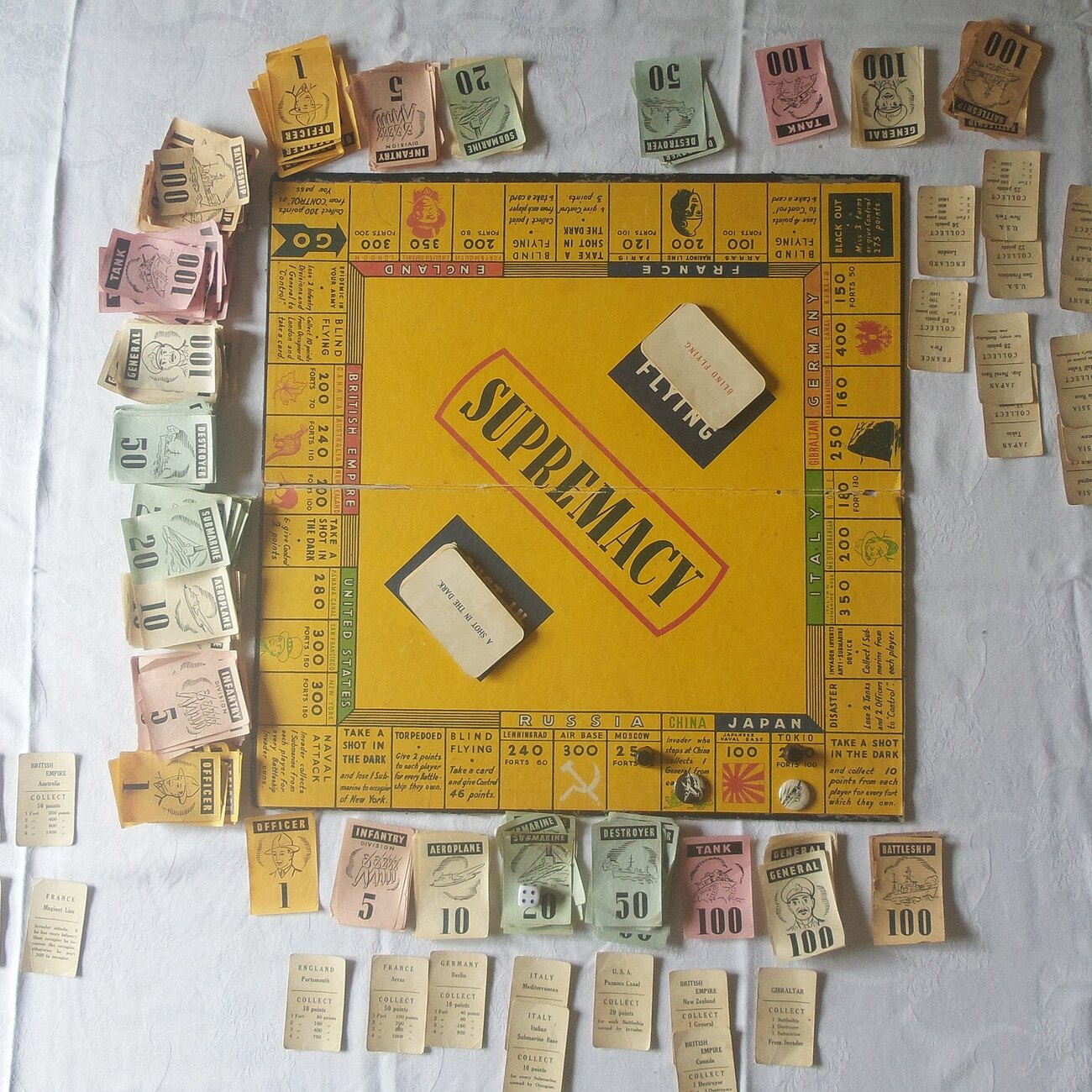 Handwritten clue notes and game board details illuminated in warm light